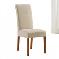 Beige fitted stretch chair cover with modern design over a tall-back dining chair, made by Orevico.